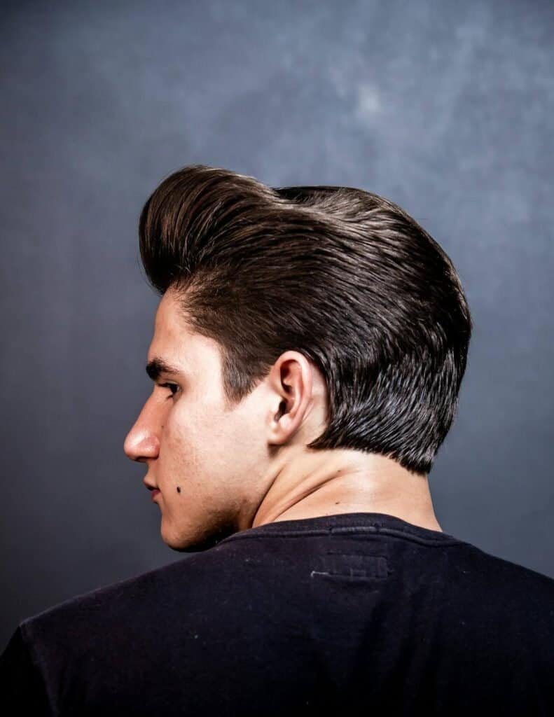 A man with a slick hairstyle showcasing how pomade works for your hair