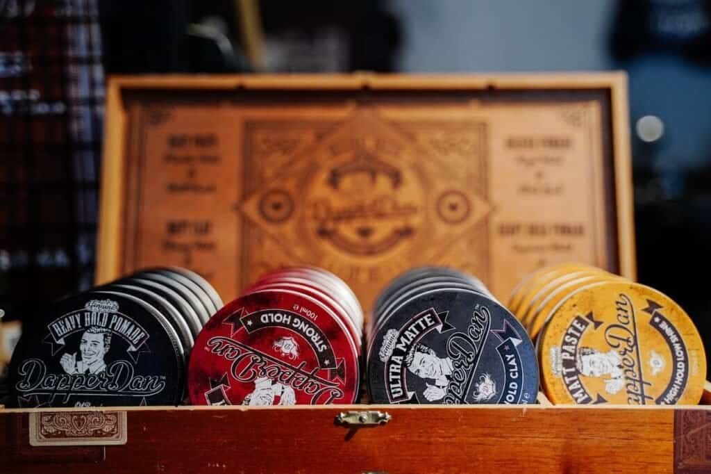 A display box containing different types of pomade