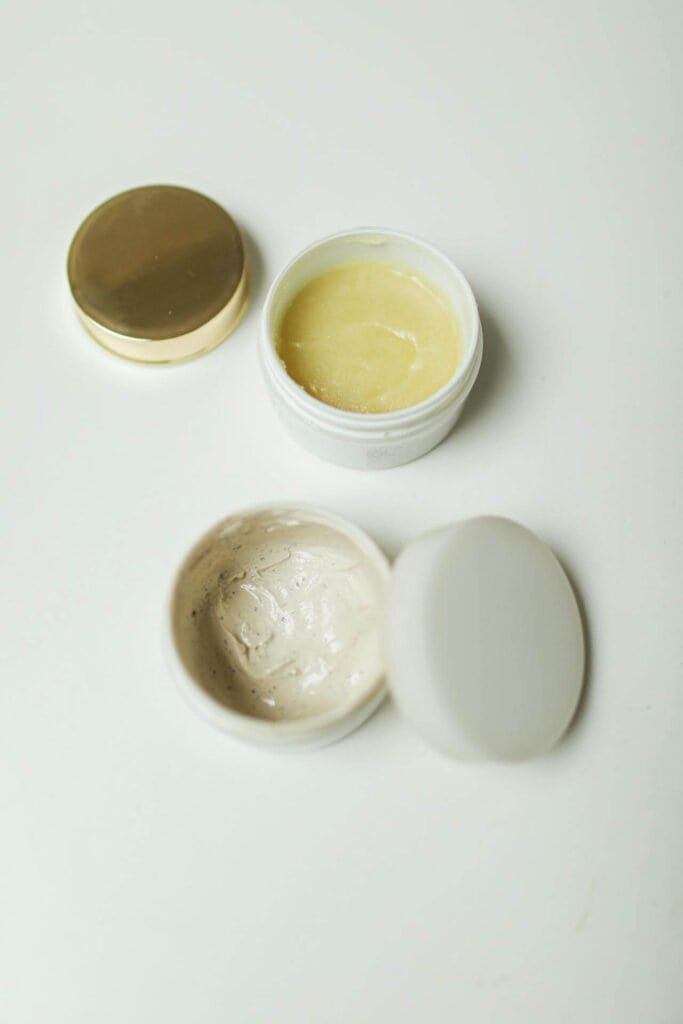 Open containers of anti-aging creams